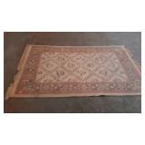 Small wool area rug, made in Turkey, in pale