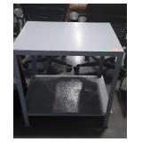 Metal work table, measures 30 inches long by 21