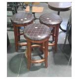 Three leather top stools, measure 24 inches tall,