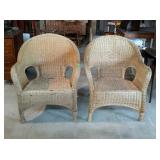 Two wicker chairs, one does have some damage on