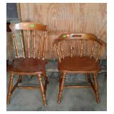 Two wooden chairs, one with arms and one with no