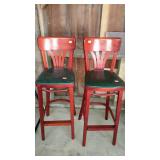 Two bar stools, one measures 43 inches tall and