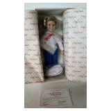 Porcelain collector, Shirley Temple doll by the