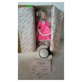 Porcelain collector, Shirley Temple doll by the