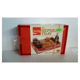 The Coca-Cola Refresh tray with original