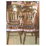 Four wooden dinning room chairs