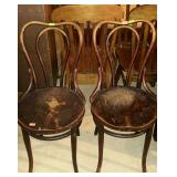 Two wooden ice cream parlor chairs