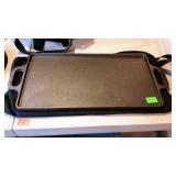 Cast iron double sided griddle. Includes carry