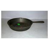 8" cast iron frying pan. No name, made in Korea.