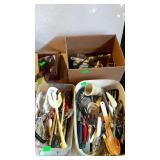 Kitchen group, bins full of utensils and a knife