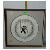 Framed print of two kids swinging, measures 17 by