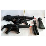 Toy air soft guns - two with extra stock, and