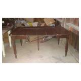 Wood table with fluted and turned legs has four