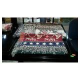 Two lap throws - one Christmas theme, and one