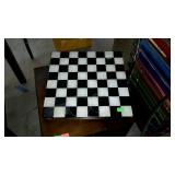 Marble chess board with game pieces