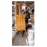 Artist easel with some paint and supplies