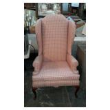 Wingback arm chair plaid queen Anne feet couple