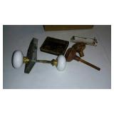 Older door hardware with porcelain & metal knobs