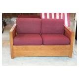 Wood framed, four cushion loveseat in This End Up