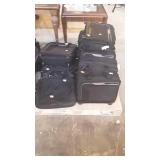 Skid lot of small suit cases