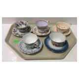 Five teacups and saucers