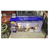 Animated reindeer and Santa on sleigh