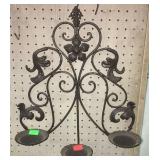 Metal wall decor candle holder measures 16 x 20"