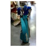 Golf bag with clubs and a telescoping ball