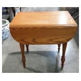 Oak drop leaf end table with single drawer and