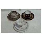 German painted china, three sets- cup, saucer, and