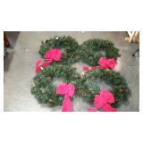Holiday decor - four wreaths with pine cones and