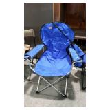 Blue camping chair with cup holders and bag.