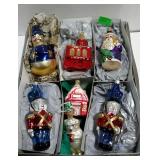 Seven glass Christmas ornaments.