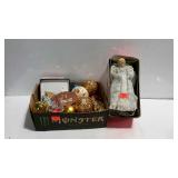 Box of assorted ornaments and a lighted angel