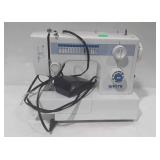 White portable sewing machine, model no. 1418