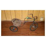Decor doll type tricycle with wicker seat. 22"