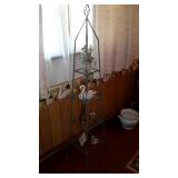 Iron what not stand with four glass shelves,