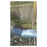 Garden lot, bag of potting soil, live scrub