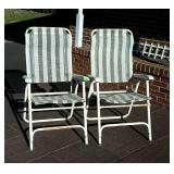 Two folding lawn chairs - Front yard