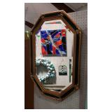 Ornate wall mirror with beveled glass. Black and
