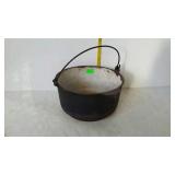 Cast iron pot with enamel interior, wire bail