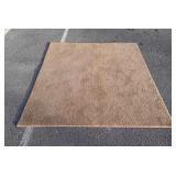 Brown rug, 71 inches long, by 54 inches wide