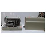 Sears Kenmore portable sewing machine with case,