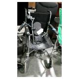 Portable wheelchair with removable footrests. Has