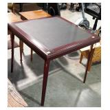 Folding card table. Wood frame with vinyl top.