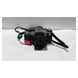 Camera, 35mm - Canon AE-1 with neck strap