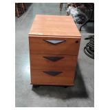 Filing cabinet, wooden on wheels with three