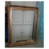 Very large gilted frame. Some finish wear.
