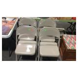 Four metal folding chairs