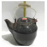 Enamel on cast iron tea kettle with wire bail hand
